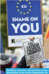  ??  ?? BRUSSELS: Protesters hold placards during a demonstrat­ion by pro-Catalan independen­ce supporters calling for the release of jailed separatist leaders yesterday.