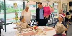  ?? Photo / Nikki Carroll ?? Birthday girl Marjorie Hall (seated) with party organiser Trish Watson (standing) and HDC Mayor Bernie Wanden.