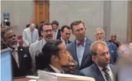  ?? ?? Clockwise from back left, Rep. Antonio Parkinson, D-Memphis, House GOP Caucus Chair Jeremy Faison, R-Cosby, Rep. Ryan Williams, R-Cookeville, House Majority Leader William Lamberth, R-Portland, and Rep. Justin Jones, D-Nashville, look on during a House session Thursday at the state Capitol in Nashville. Lawmakers gave approval to the state budget.