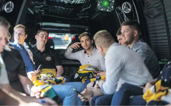  ?? PHOTOS: LIAM RICHARDS ?? Surviving members of the Humboldt Broncos and some of their supporters travel back to their hotels following an NHL media event in Las Vegas on Tuesday.