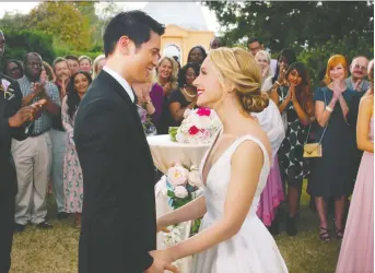  ?? UNIVERSAL PICTURES ?? The characters played by Harry Shum Jr., left, and Jessica Rothe have a picture-perfect wedding in All My Life.