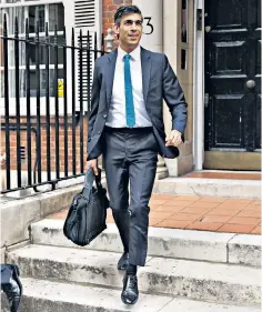  ?? ?? Rishi Sunak looked the man about town in a £3,500 suit as he headed to Parliament