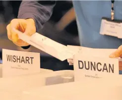  ??  ?? Neck and neck Ballot papers pile up for Pete Wishart and Ian Duncan at the general election count. Picture by Richard Wilkins