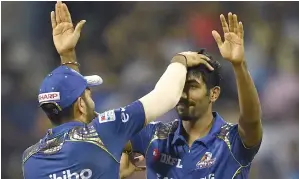  ?? AFP ?? Bumrah snapped up three crucial wickets as Mumbai Indians kept their play-off hopes alive. —