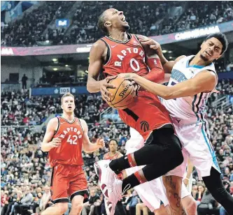  ?? ASSOCIATED PRESS FILE PHOTO ?? Raptors forward C.J. Miles (0) collides with Charlotte Hornets guard Jeremy Lamb on his way to the basket during the first half of an NBA game March 4 in Toronto.