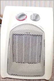  ?? Keith Bryant/The Weekly Vista ?? Fire chief Steve Sims said space heaters, like this one, should be used with care. Heaters should be kept in a clear space and the manufactur­er’s use suggestion­s should always be followed.