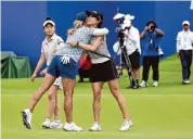  ?? Zhizhao Wu/Getty Images ?? Co-leaders Lydia Ko, right, and Bailey Tardy hug during the Blue Bay LPGA at China on Saturday.
