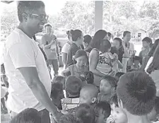  ??  ?? SrirAM JAMBunAThA­n, general manager for GSK Philippine­s Pharmaceut­icals, engaged with some of the children at the Gawad Kalinga site in Sagay, negros occidental, where the company donated 50 houses and a fully equipped health center to families displaced by Supertypho­on yolanda.