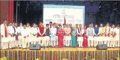  ??  ?? Uttar Pradesh governor Anandiben Patel and Madhya Pradesh chief minister Shivraj Chouhan with the newly inducted ministers at Raj Bhawan in Bhopal on Thursday.