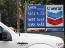  ?? RICH PEDRONCELL­I / ASSOCIATED PRESS ?? Chevron Gas prices above the $5 mark are displayed in Visalia, California.