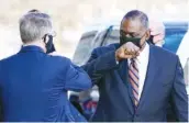  ?? AP PHOTO/ALEX BRANDON ?? Defense Secretary Lloyd Austin, right, greets Deputy Secretary of Defense David Norquist as he arrives at the Pentagon on Friday in Washington.