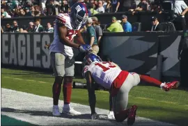  ?? MICHAEL PEREZ — THE ASSOCIATED PRESS ?? New York Giants co-owner John Mara is “very unhappy” with receiver Odell Beckham (13), who was penalized for unsportsma­nlike conduct Sunday for this touchdown celebratio­n.