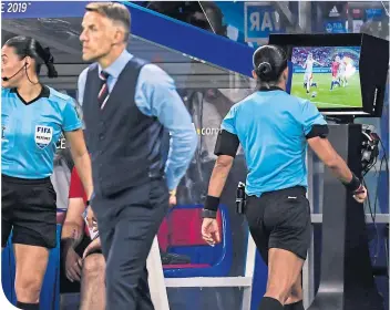  ??  ?? Phil Neville waits and wonders after yet another decision goes to VAR