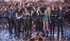  ?? ABC/ ERIC MCCANDLESS ?? Madison VanDenburg, front left, claps for American Idol winner Laine Hardy, center, during the season finale.
