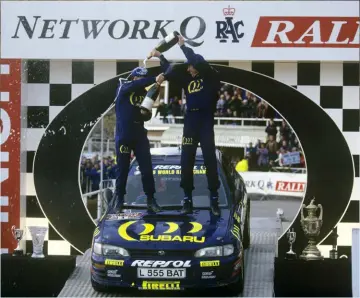  ?? ?? Co-driver Derek Ringer and Colin McRae celebrate the title at Chester Racecourse