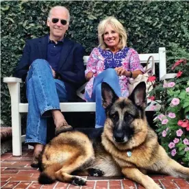  ??  ?? Joe and Jill Biden with their 12-year-old dog Champ. Photograph: Joe Biden/Instagram