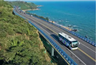  ?? ?? A bus travels along the recently opened round-the-island highway in Hainan Province on February 21