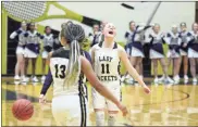  ?? / Jeremy Stewart ?? Rockmart’s Megan Little (11) yells in celebratio­n after the Lady Jackets defeated Elbert County in the second round of the GHSA state basketball playoffs in Rockmart on Wednesday.