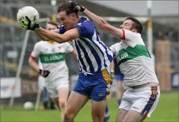  ??  ?? Jack O’Connor of Gusserane wins this duel with Eoin Doyle (Taghmon-Camross), but last year’s Intermedia­te winners had the last laugh as they surprised Senior title-holders in Innovate Wexford Park on Sunday.