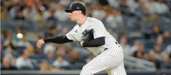  ?? JIM MCISAAC/GETTY ?? The Yankees’ Scott Effross pitches during the seventh inning against the Mariners at Yankee Stadium on Aug. 2 in New York.