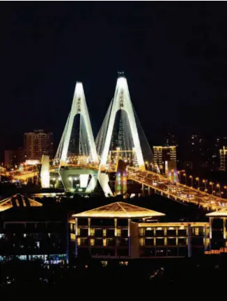  ??  ?? Located in Haikou, Hainan Province, the Century Bridge measures 2,664 meters in length. It is a landmark structure and a major tourist attraction of the city. by Qin Bin
