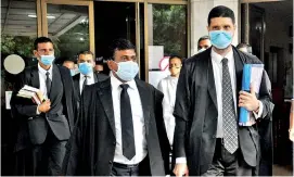  ??  ?? Lawyers appearing in the fundamenta­l rights cases relating to the upcoming polls leaving the court premises. Pic by Priyantha Wickramaar­achchi