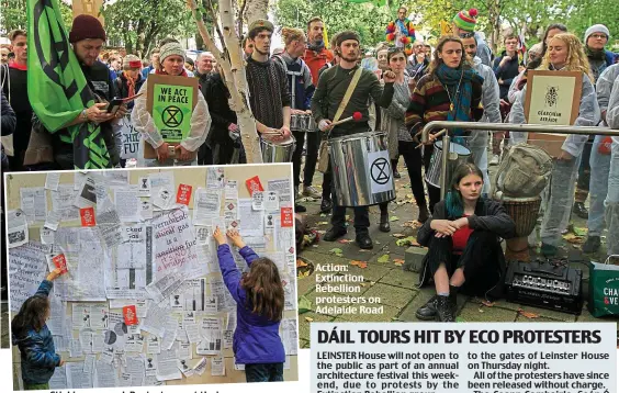  ??  ?? Sticking around: Protesters get their message across Action: Extinction Rebellion protesters on Adelaide Road