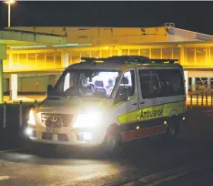  ??  ?? PRECAUTION: An ambulance takes a passenger for assessment from Cairns Airport on Thursday night.