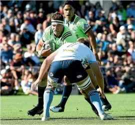  ??  ?? The Highlander­s’ Luke Whitelock is tackled by Will Miller of the Waratahs during the Super Rugby trial match in Alexandra last week.