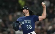  ?? LINDSEY WASSON — THE ASSOCIATED PRESS ?? Seattle Mariners starting pitcher Robbie Ray throws against the Cleveland Guardians during the first inning on March 31, 2023, in Seattle.