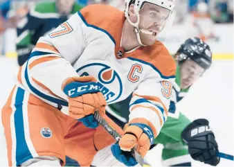  ?? JONATHAN HAYWARD/THE CANADIAN PRESS VIA AP ?? Oilers captain Connor McDavid says the NHL’s COVID-19 protocols are“tough,”but players feel“lucky”to be able to compete this season.