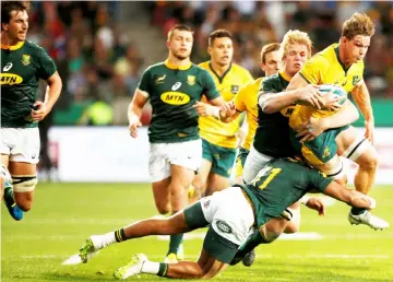  ??  ?? Australia’s captain Michael Hooper (right) in action during the Rugby Championsh­ip match against South Africa at Nelson Mandela Bay Stadium in Port Elizabeth, South Africa in this Sept 29. — Reuters photo