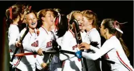  ?? DEBEE TLUMACKI FOR THE GLOBE ?? The Reading field hockey team celebrated the first of its five goals in a Division 2 semifinal shutout against Hingham.