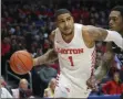  ?? THE ASSOCIATED PRESS ?? In this Feb 1, 2020, file photo, Dayton’s Obi Toppin (1) drives to the basket against St. Louis forward Jimmy Bell Jr. (32) during the second half of an NCAA college basketball game in Dayton, Ohio. Toppin is a possible pick in the NBA Draft, Wednesday, Nov. 18, 2020.