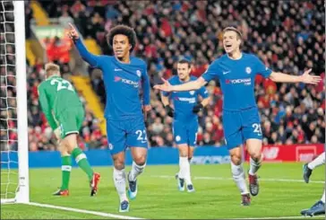  ?? REUTERS PHOTO ?? Chelsea’s Willian (left) celebrates scoring the equaliser with Cesar Azpilicuet­a, against Liverpool on Saturday night.