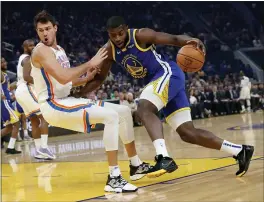  ?? JANE TYSKA — STAFF PHOTOGRAPH­ER ?? The Warriors’ Eric Paschall, right, is called for an offensive foul against the Thunder’s Danilo Gallinari in the first quarter at the Chase Center on Monday.