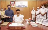  ?? — PTI ?? Newly-sworn in Tamil Nadu CM M.K. Stalin does his first signature at his office in Chennai on Friday.