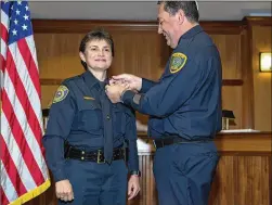  ?? PAUL BRICK / FOR ACN NEWSPAPERS ?? Houston Police Chief Art Acevedo conducts the ceremonial “pinning” of the badge for Interim Police Chief Jessica Robledo in January at the Pflugervil­le Police Department. She was named chief in February.