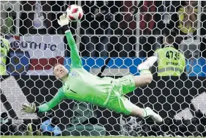  ?? — AP FILES ?? Goalkeeper Jordan Pickford saves a penalty against Colombia as England put an end to the shootout curse on Tuesday.