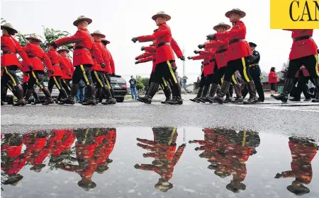  ?? JEFF MCINTOSH / THE CANADIAN PRESS ?? The RCMP’s recent decision to loosen entrance requiremen­ts, including allowing permanent residents to apply and easing fitness testing, has been met with “grave reservatio­ns” from an associatio­n representi­ng some Mounties, who claim the “knee jerk” changes lower standards.