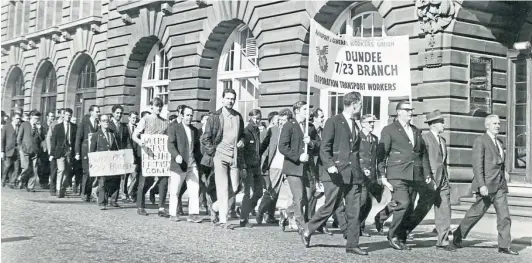  ?? ?? OFF THE BUSES: Busmen marching in Dundee city centre in September 1968 after apparently holding a meeting at which they decided to resume work following four weeks of strike action. Can any readers provide further details surroundin­g the picture?