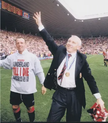  ??  ?? Peter Reid and Kevin Ball after sealing promotion in 1999.