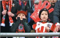  ?? JOHN WALTON / FOR CHINA DAILY ?? Young Southampto­n fans in the stands react during a game.