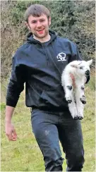  ??  ?? Karol with one of his lambs.