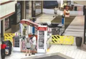  ?? STAFF PHOTO BY ERIN O. SMITH ?? The food court on the first floor of Hamilton Place mall is blocked off by yellow barriers Wednesday. A flash flood in the Hamilton Place area caused water to enter into and eventually close the food court at the mall Wednesday afternoon.