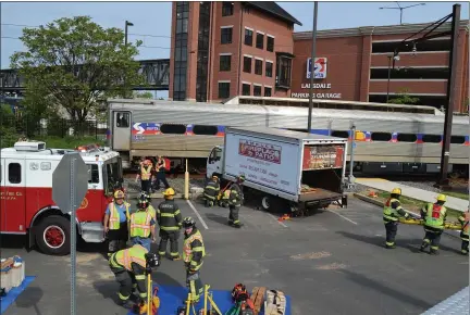  ?? RACHEL RAVINA — MEDIANEWS GROUP ?? An aerial view showcases a simulation involving a box truck and a train. The Sunday morning training exercise simulates a crash at the Lansdale SEPTA Regional Rail station, at 101W. Main St.