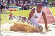  ?? Steven eckhoff ?? Rockmart’s Zoryan Hendricks lands in the pit while competing in the Class AA boys’ triple jump Friday at the GHSA Track and Field State Championsh­ips at Berry College. Hendricks won the state title after a leap of 46 feet, 6 inches.