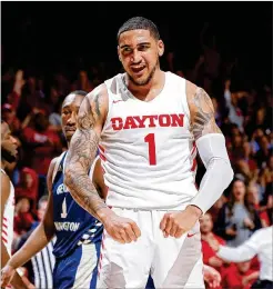  ?? JOE ROBBINS / GETTY IMAGES / TNS ?? Dayton’s Obi Toppin reacts after a dunk against George Washington in March. Tobbin averaged 20 points and 7.5 rebounds last season.