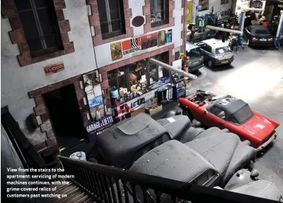  ??  ?? View from the stairs to the apartment: servicing of modern machines continues, with the grime-covered relics of customers past watching on