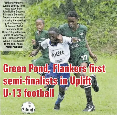  ?? (Photo: Paul Reid) ?? Flankers Primary’s Everald Lindsay (left) gets away from John Rollins Success Primary’s Damarion Ferguson on his way to scoring the opening goal in Tuesday’s St James FA/VM Foundation Uplift Under-13 quarter-final game at Wespow Park. Flankers Primary won 3-1 to advance to the semi-finals.